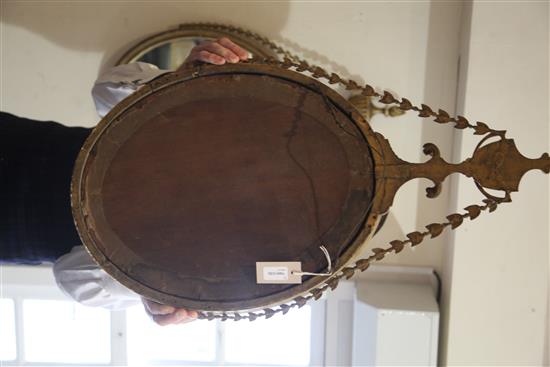 A pair of George III giltwood and gesso oval wall mirrors, W.1ft 5in. H.2ft 7.5in.